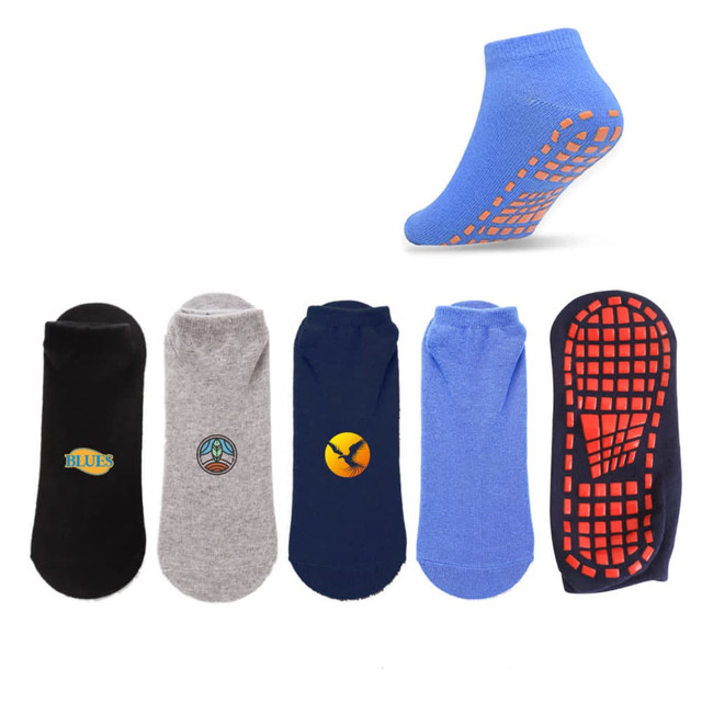 Low cut gripper socks in black, grey, and blue, featuring various designs and an anti-slip sole.