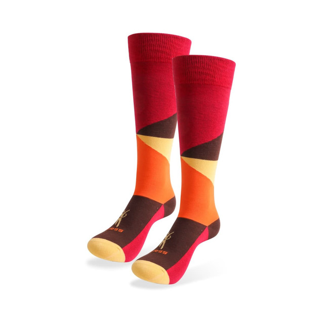 Mid calf socks featuring a vibrant pattern in red, orange, yellow, and brown, with a logo on the design.