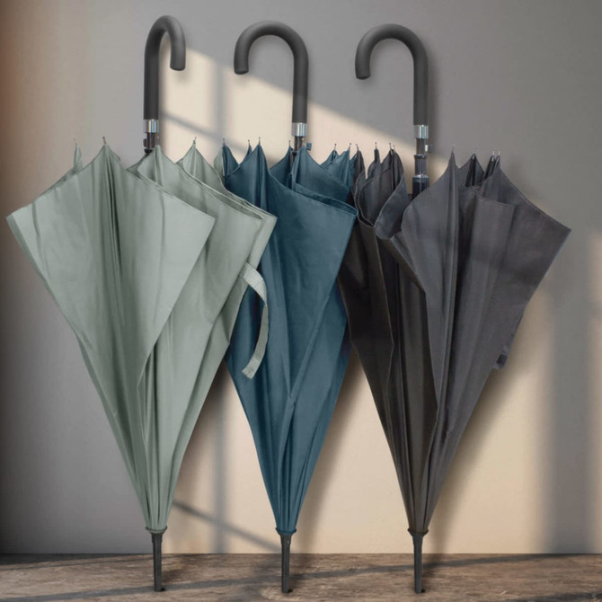 A collection of three Pegasus Hook Umbrellas in green, teal, and dark grey, each featuring a curved handle.