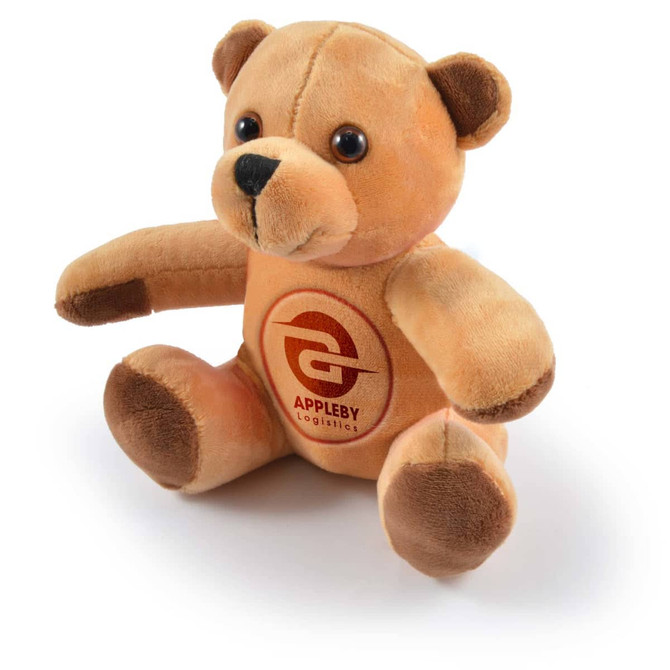 A plush teddy bear with a soft, tan exterior and dark brown accents, featuring a printed logo on its belly.
