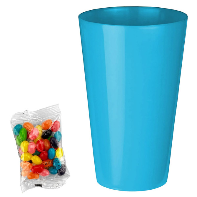 A bright blue party cup alongside a packet of multi-coloured jelly beans.