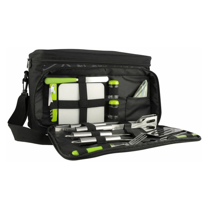 A black picnic bag with green accents, containing utensils, a cutting board, drink bottles, and a napkin.