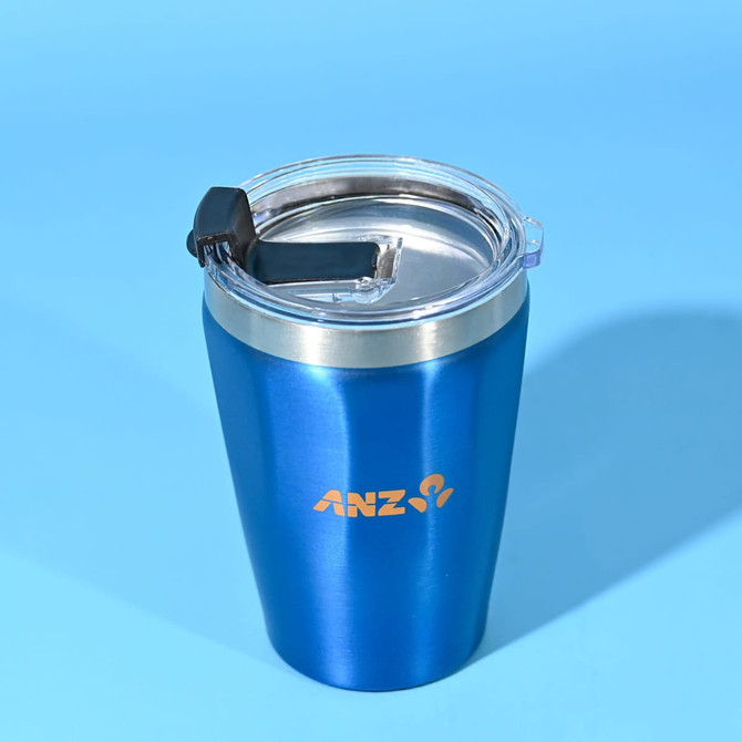 A drink bottle featuring a blue metallic finish, with a clear lid and a black sliding closure. It has a logo on the front.