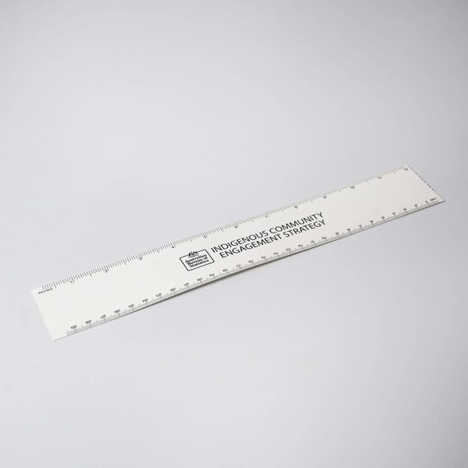 A white ruler with markings and a logo, designed for office and business use.