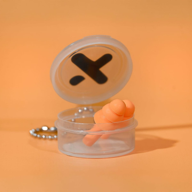 A clear keychain case containing orange silicone earplugs, set against an orange background.