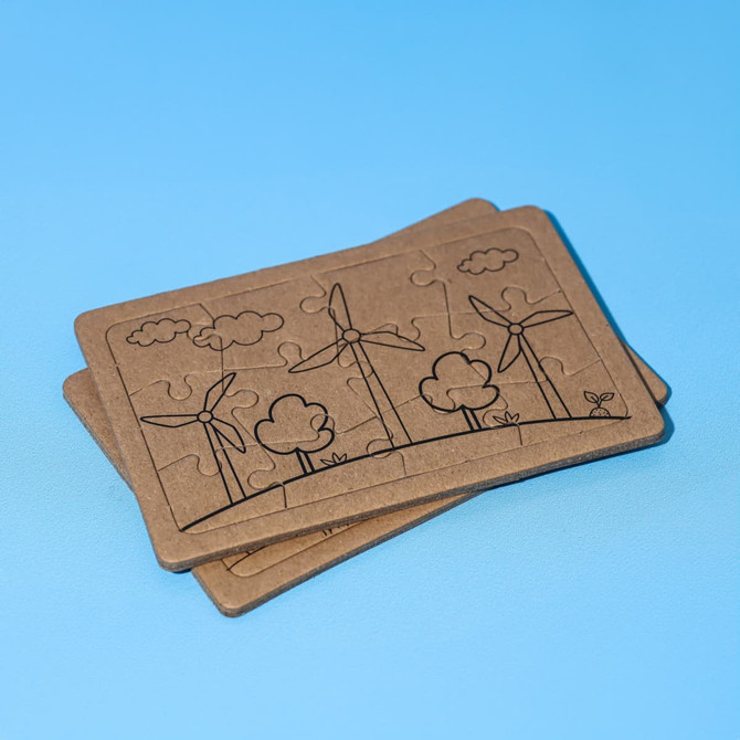 A jigsaw puzzle set featuring two puzzles with wind turbines and trees, made of brown cardboard.