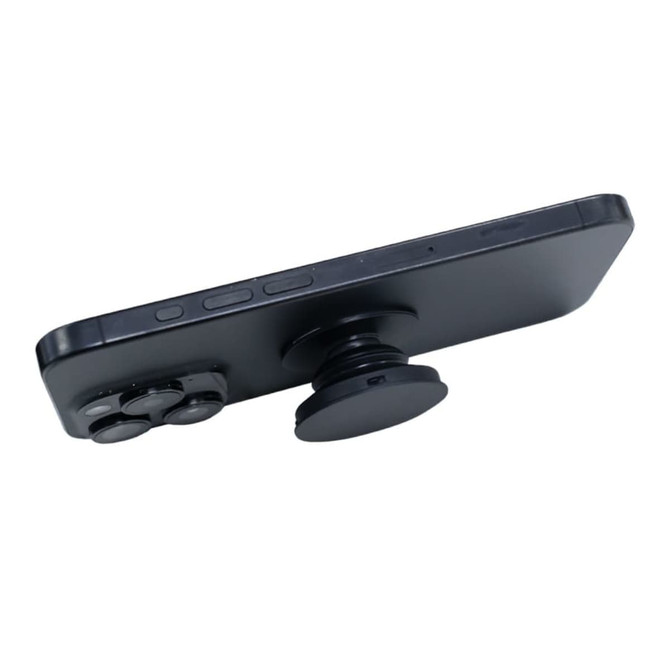 A black phone with a circular phone grip attached, featuring additional buttons for enhanced functionality.