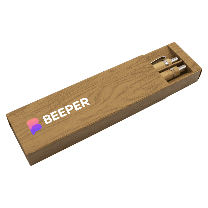 A bamboo pen set in a wooden box, featuring two pens and a logo on the box.