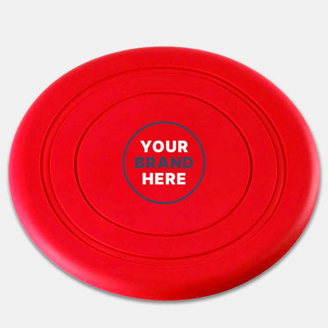 A red silicone frisbee featuring a central logo area and smooth, rounded edges.