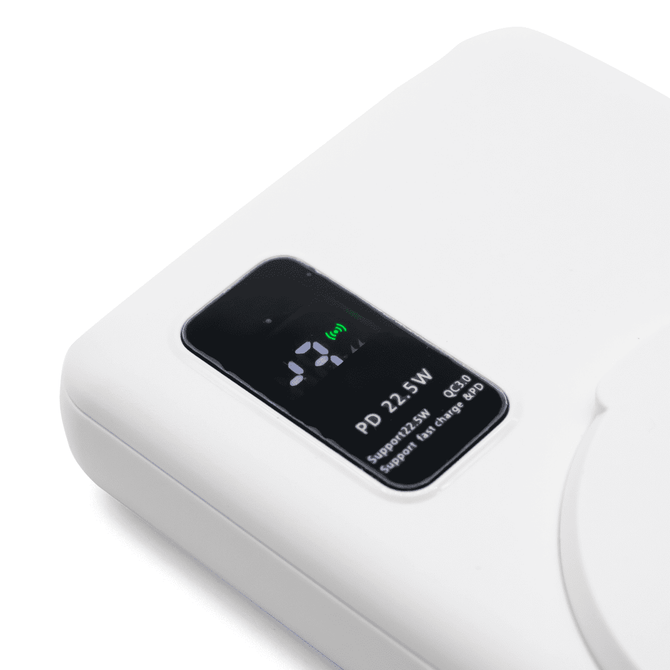 A white power bank with a digital display, showcasing its features and specifications.