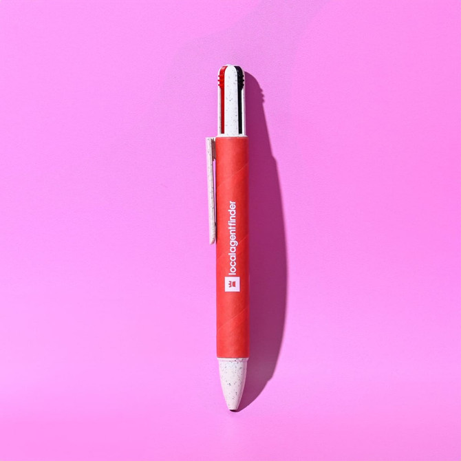 A red eco-friendly pen with a white tip and a branding logo, displayed on a pink background.