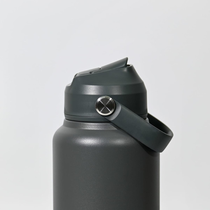 A drink bottle in a dark grey colour with a secure lid and a carrying strap. It features a logo on the body.