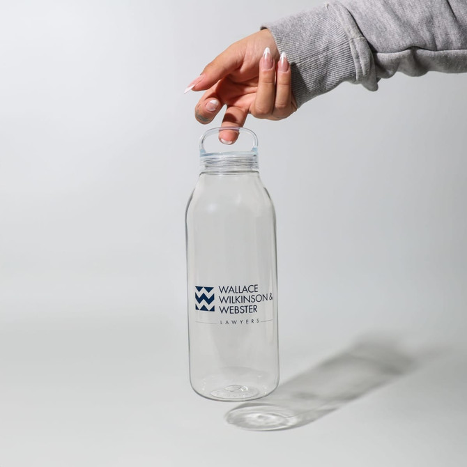A drink bottle with a clear design and a lid, featuring a logo in blue on the front.