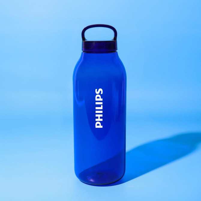 A drink bottle in vibrant blue colour, featuring a handle and a logo on the front.