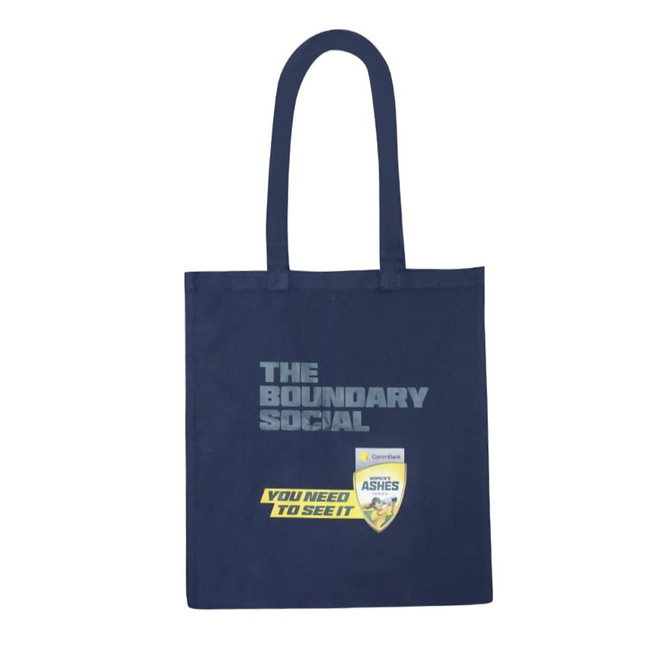 A navy-blue tote bag with a logo and a graphic design featuring vibrant colours.