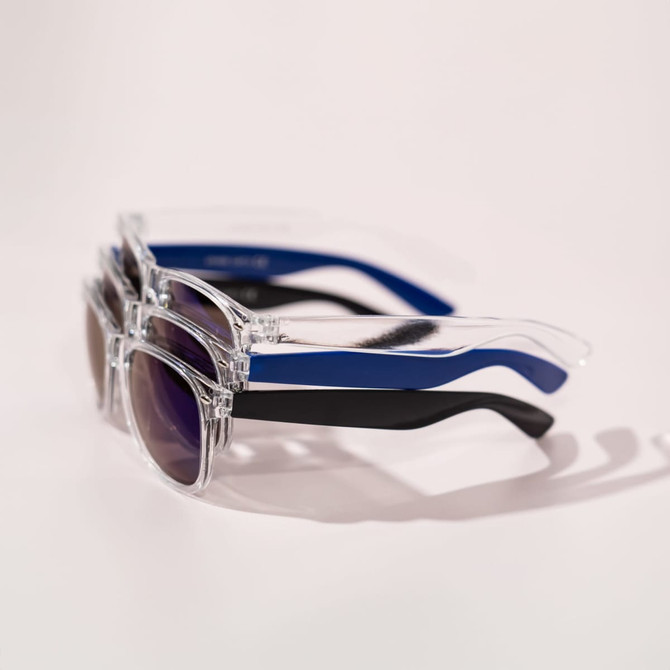 Three pairs of Haze sunglasses, featuring clear frames with purple lenses, and arms in blue and black.