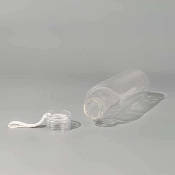 A drink bottle made of clear borosilicate glass, featuring a white lid and a minimalist design.
