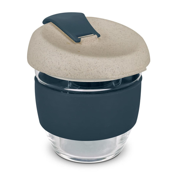 A drink bottle featuring a natural speckled lid and a navy silicone sleeve, with a clear glass body.