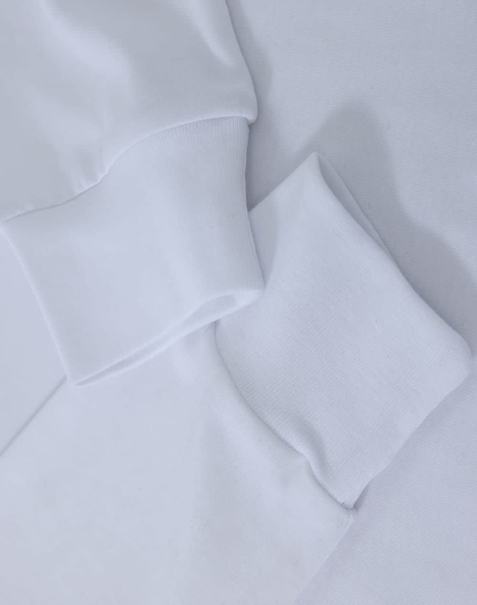 A white long-sleeve tee shirt with premium cotton fabric and cuff details. The image includes a logo.