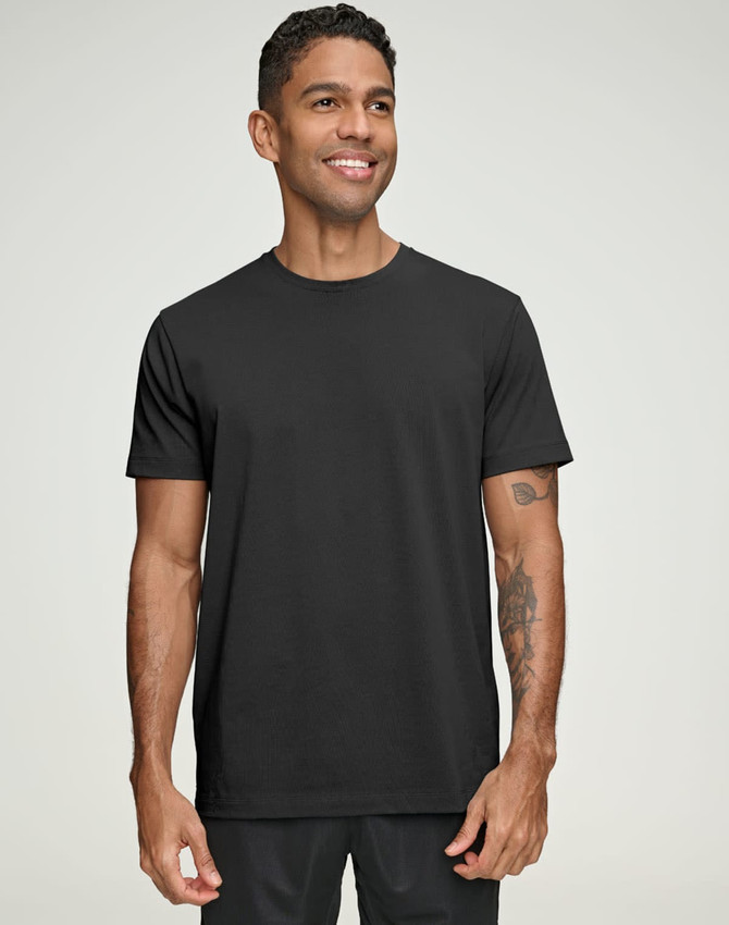 A men's premium cotton short sleeve tee shirt in black, featuring a logo on the chest, worn by a smiling model.