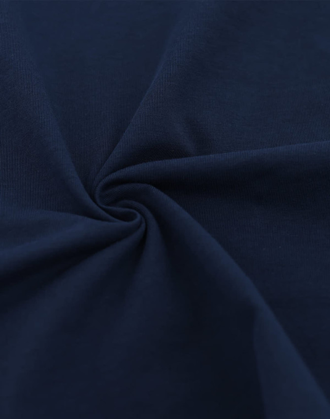 A close-up of navy blue fabric showcasing a soft, premium cotton texture with a spiral design.