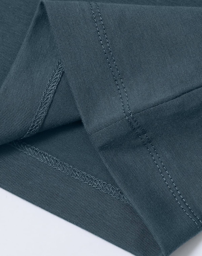 A close-up of a ladies' premium cotton short sleeve tee shirt in a muted blue-grey colour with visible stitching details.