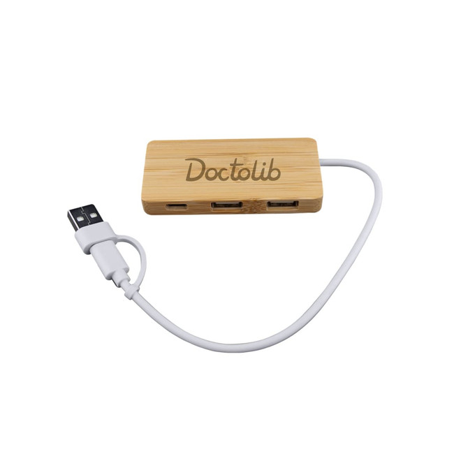 A bamboo USB hub with three ports and a white connecting cable, featuring a logo on the surface.