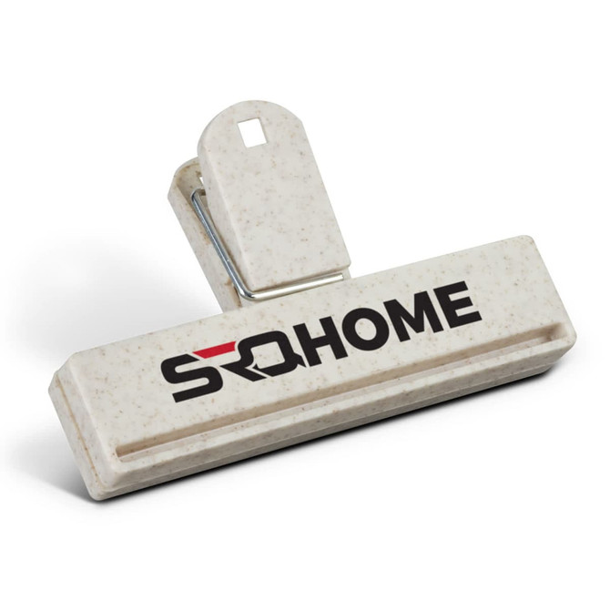 A cream snack bag clip with a logo, featuring a sturdy grip and a wide opening for securing bags.