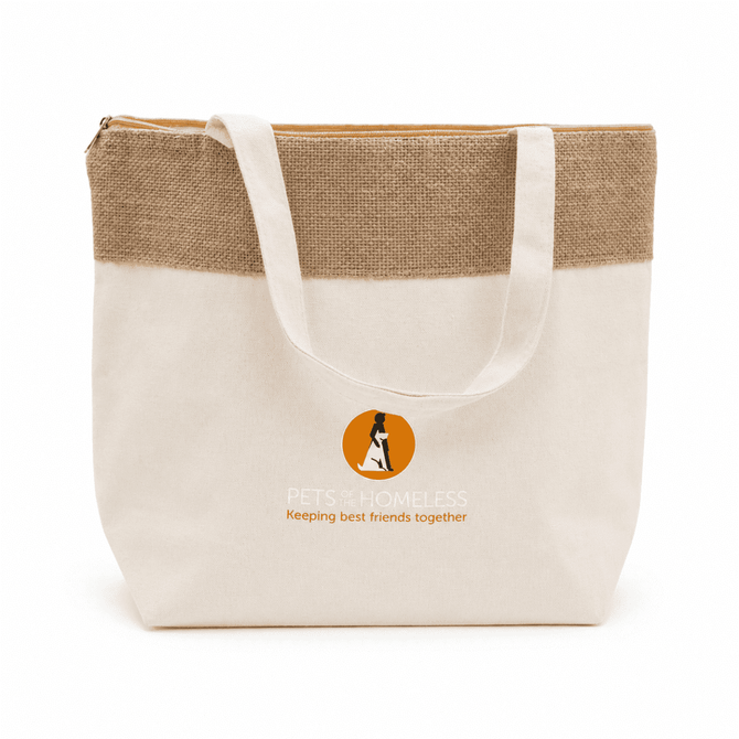 A jute and cotton cooler bag in cream and tan with a logo on the front, featuring sturdy handles.