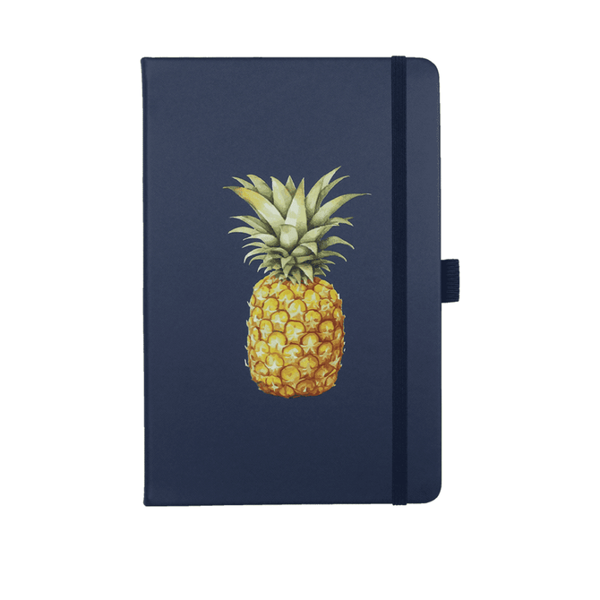 A navy journal with a pineapple illustration on the cover. It features an elastic band closure and has branding.