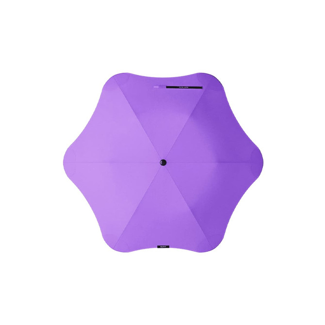 A purple BLUNT Metro Umbrella with a unique octagonal shape and a central button. The umbrella features a branding logo.
