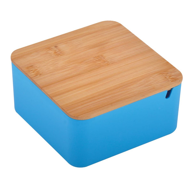 A square toiletry bag in bright blue with a natural bamboo lid and a small opening. It features a logo.