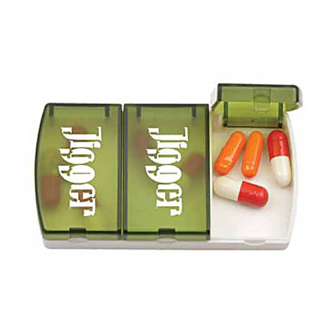 A green and white pill box with compartments containing red and orange capsules and a logo.