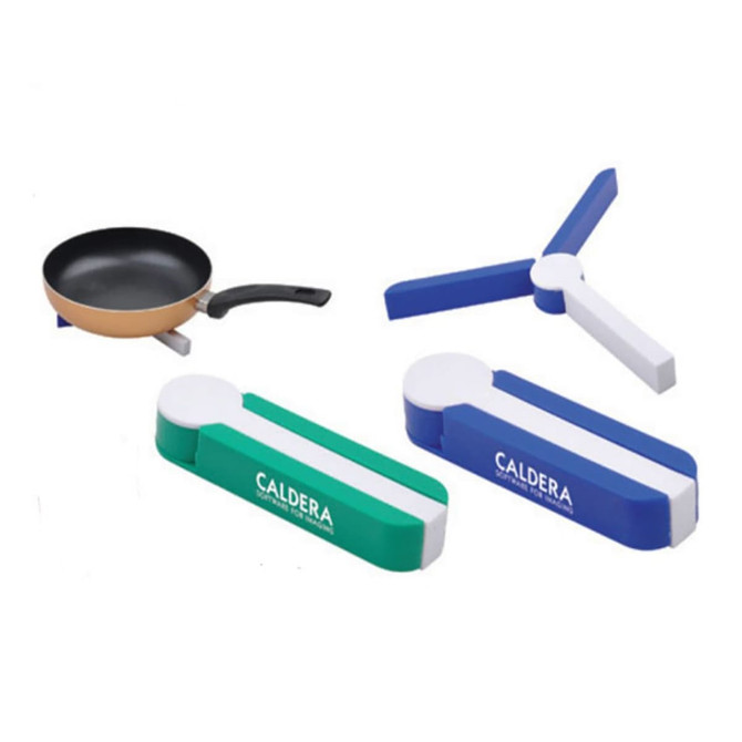A collection of colourful hot pot mats in green, blue, and white, alongside a frying pan. The mats feature a logo.
