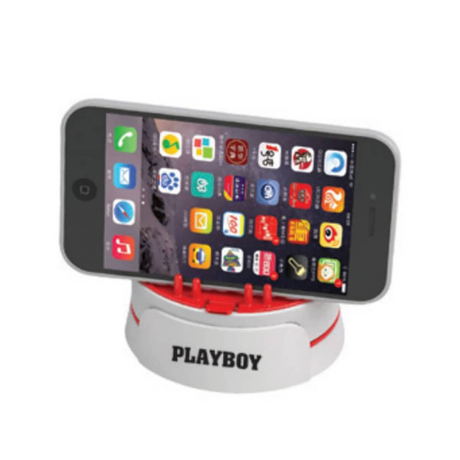 A mobile stand screen cleaner in white and red, holding a smartphone upright. It features clips and a logo.