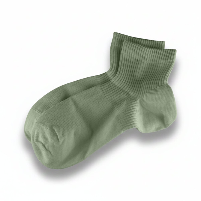 A pair of light green ribbed socks with a crew length design, featuring a logo.