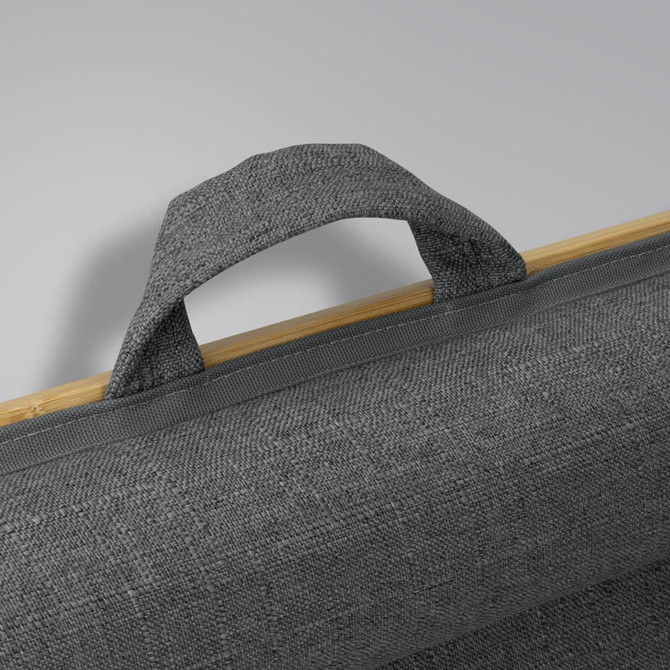 A grey fabric handle attached to a bamboo lap desk, highlighting the texture and natural material.