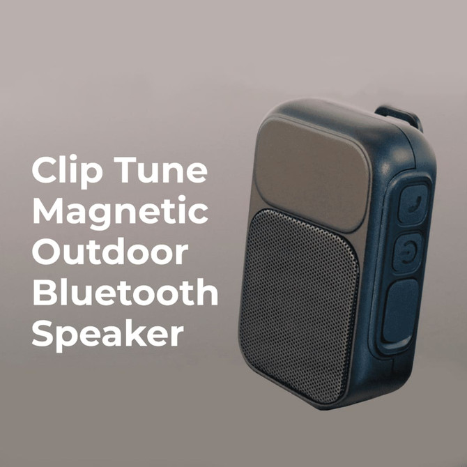 A black and grey Bluetooth speaker with a magnetic back and control buttons, featuring a mesh speaker grille.