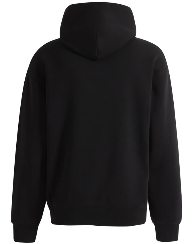 A black unisex premium fleece oversized hoodie with a hood, featuring a simple design and no visible logos.