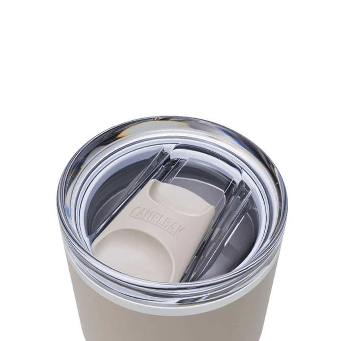 A drink bottle with a lid featuring a clear top and beige elements, showcasing a sleek, modern design.