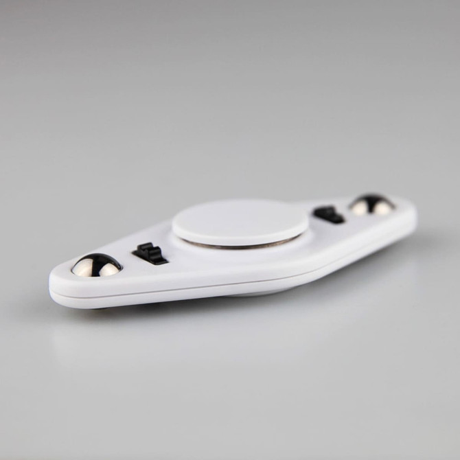 A white fidget spinner with a central circular area and black accents, featuring two smooth spinning balls.
