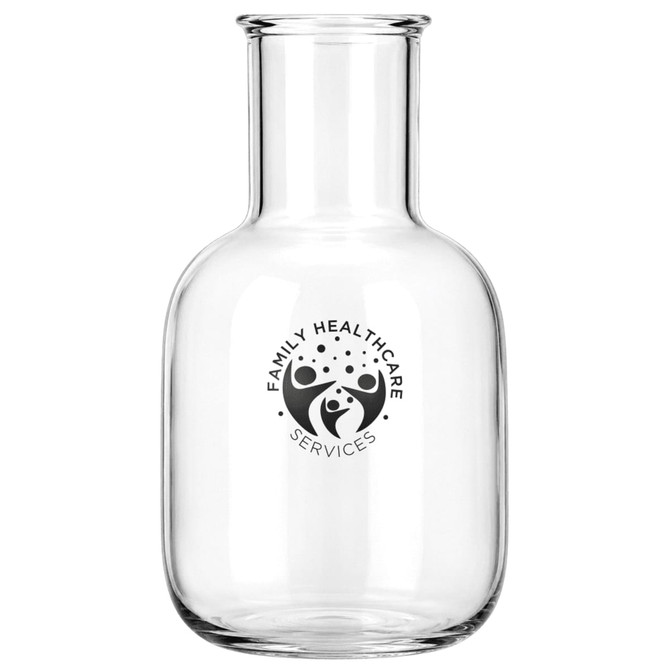 A glass carafe with a round body and a narrow neck, featuring a logo. Clear in colour.