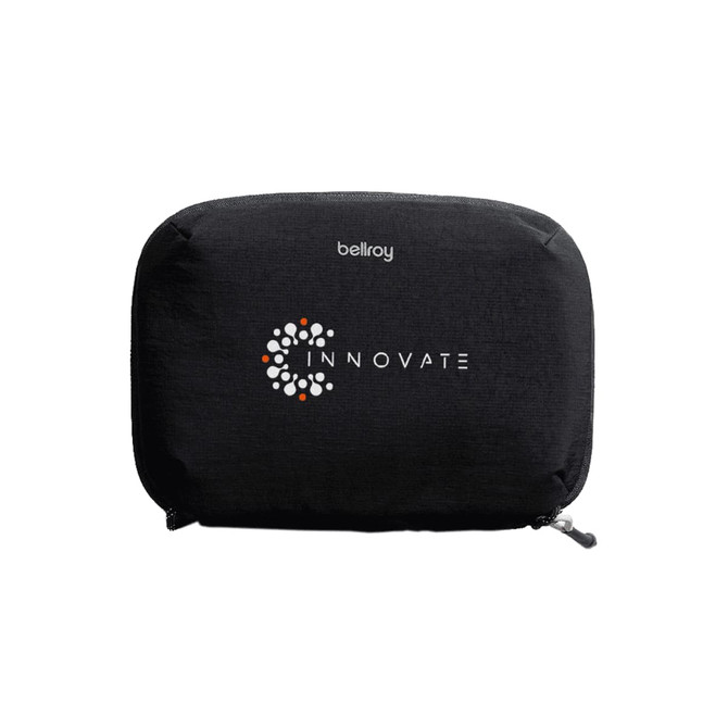A black tech kit with a zip closure, featuring a logo on the front and a sleek design.