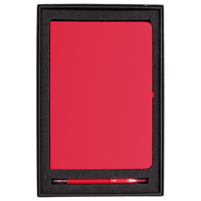 A red journal and pen gift set displayed in a black box with a foam insert. The box includes a logo.