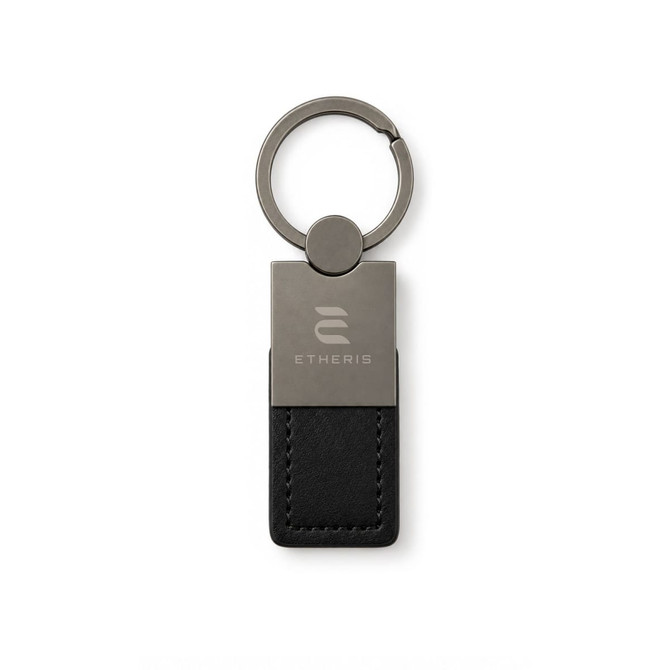 A keytag featuring a metal and black leather design, with a circular keyring and a logo.