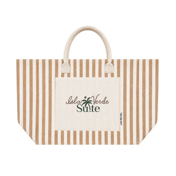 A tan and cream striped tote bag features a front pocket and handles, with a subtle logo displayed.