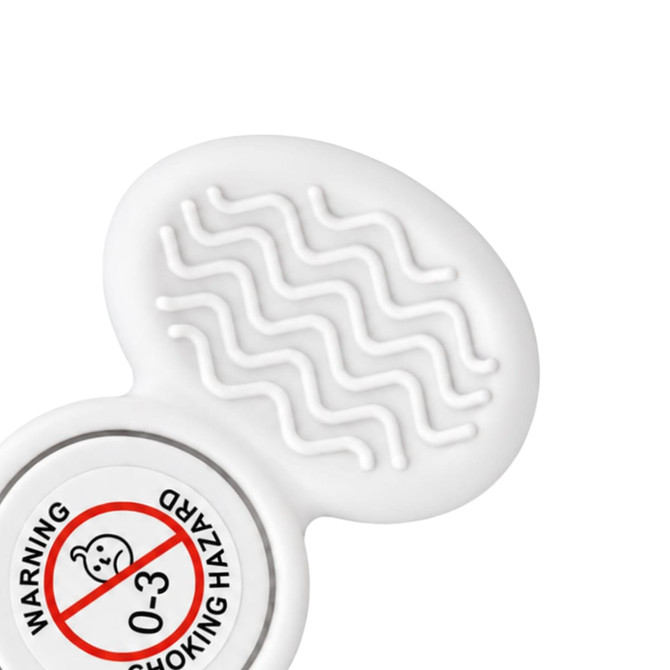 A tactile fidget spinner in white with a textured surface and a circular base featuring a warning label.
