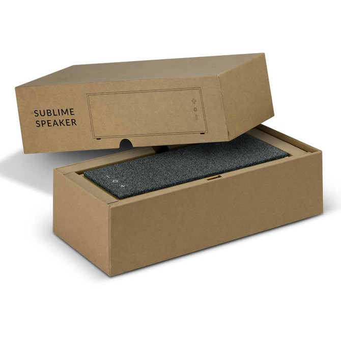 A grey Bluetooth speaker inside a stylish brown box with a minimalist design and a logo.