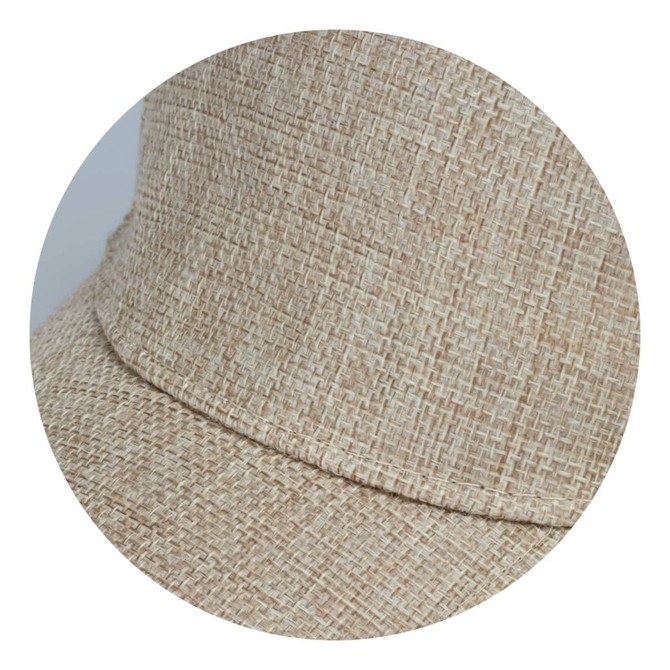 A beige cap with a textured woven design, featuring a curved brim and an integrated logo.