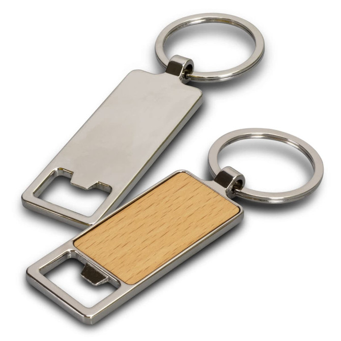 A drink bottle opener key ring with a silver metal finish and a wooden panel. It includes a logo on the surface.